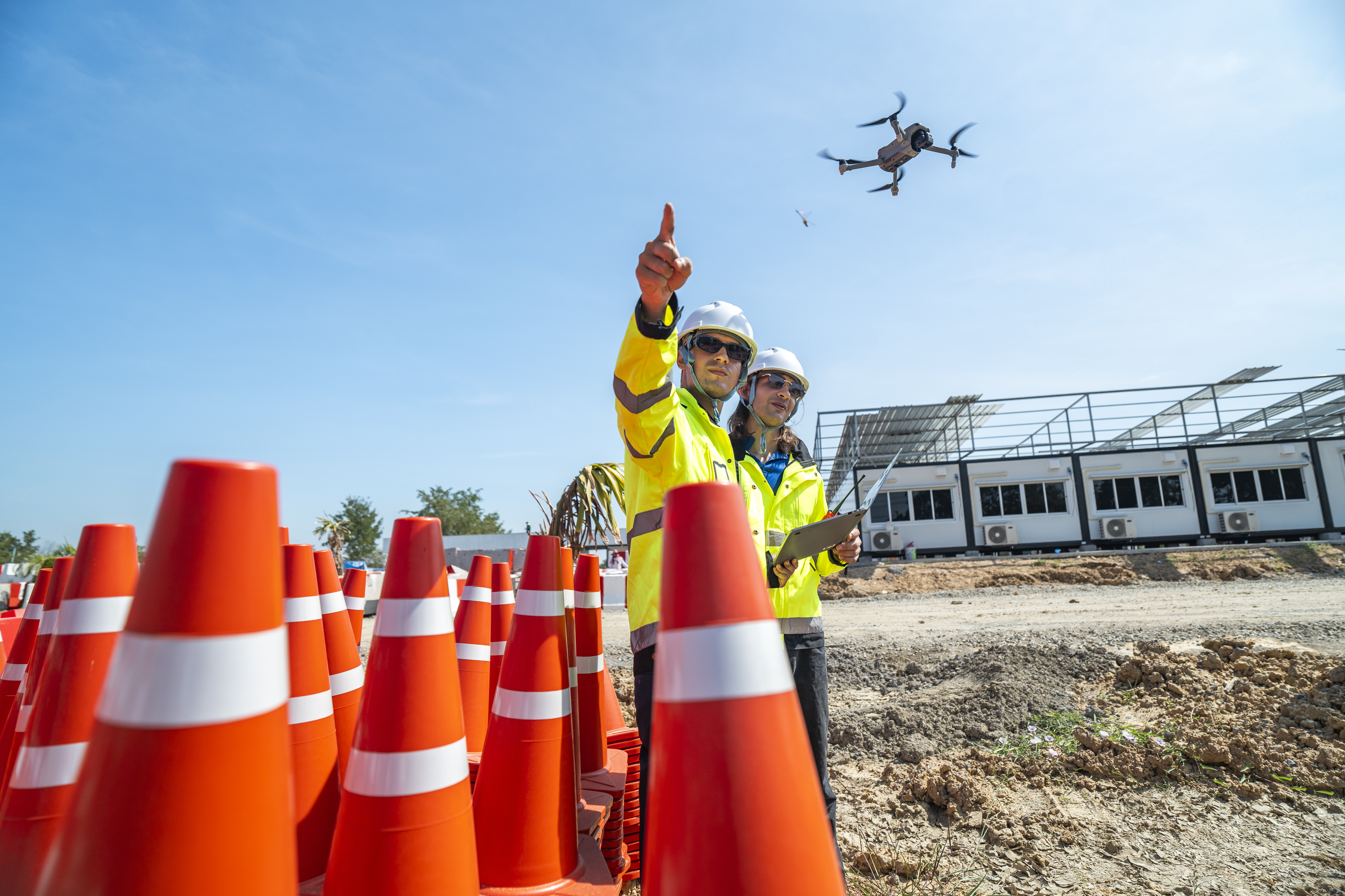 two-engineers-sit-amidst-red-and-white-barricades-2025-08-26-01-26-32-utc